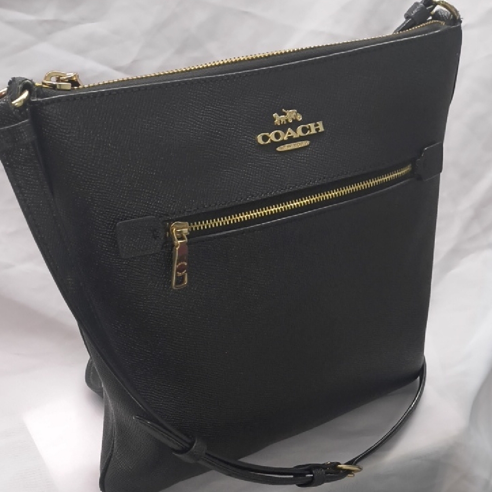Coach Rowan File Black Leather Crossbody Bag with Gold Carriage Logo Detal.